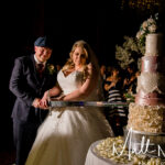 Bride and Groom cutting Cake