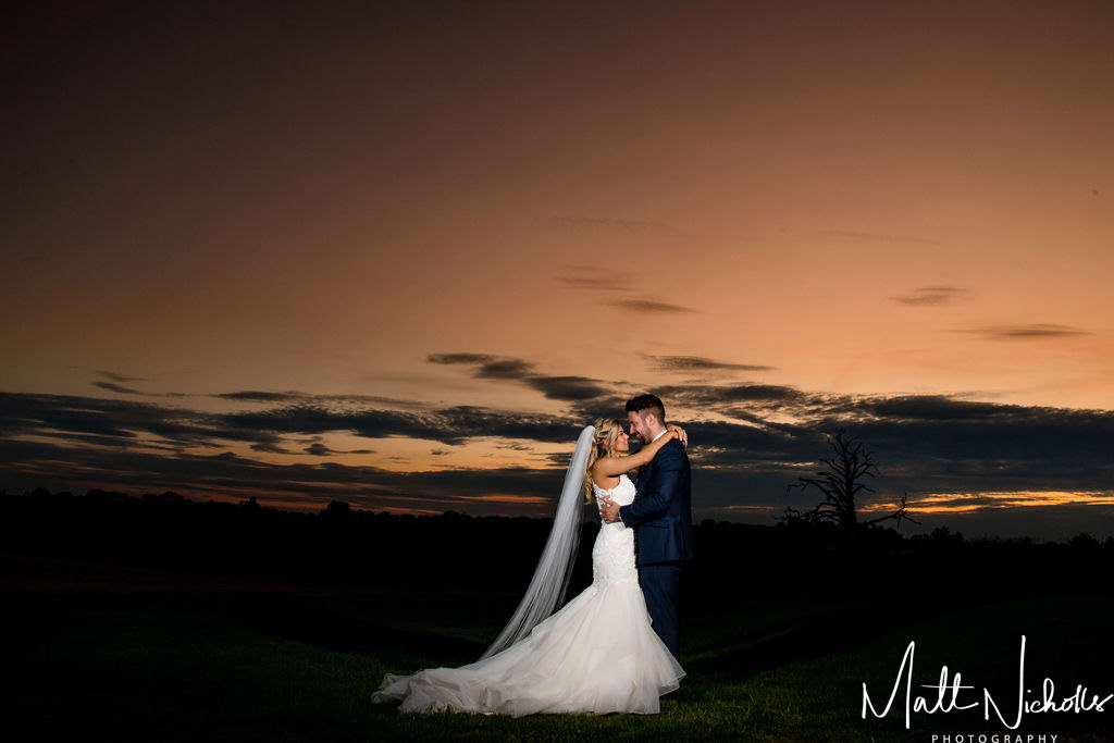 Bride and Groom at sunset Priory Cottages Wedding